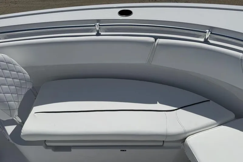 Slide: The Image of 2026 Sportsman Open 252 Center Console boat with cushioned seating area. - 9