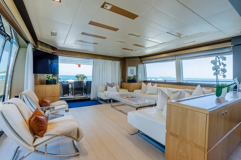 Slide: The Image of Luxurious yacht interior with modern decor, spacious seating, and ocean views. Custom Line 100, 2012 model. - 14