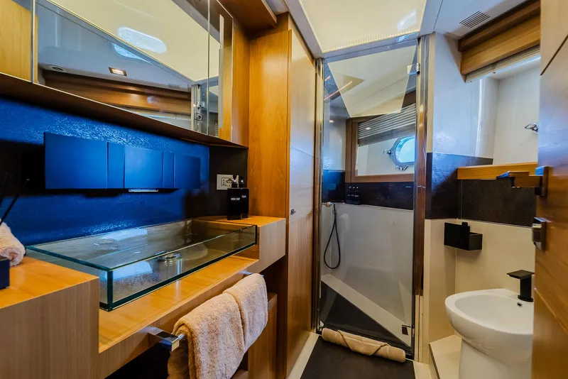 Slide: The Image of Luxurious yacht bathroom with glass sink, wooden accents, and modern shower, Custom Line 100, 2012. - 24