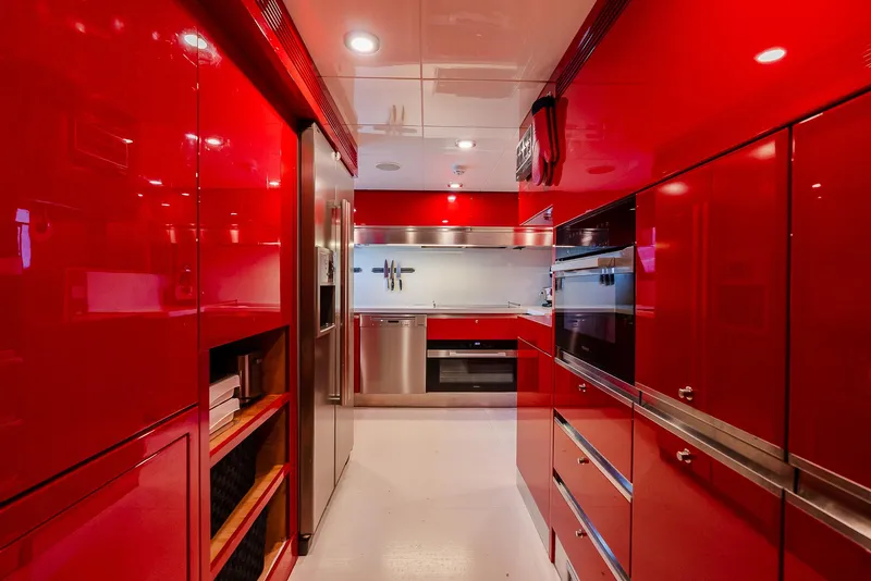 Slide: The Image of Luxurious red kitchen interior in a 2012 Custom Line 100 yacht. - 32