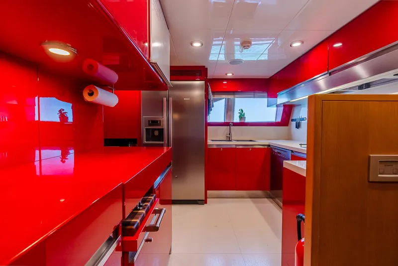Slide: The Image of Sleek modern kitchen with vibrant red cabinetry and stainless steel appliances, Custom Line 100, 2012. - 33