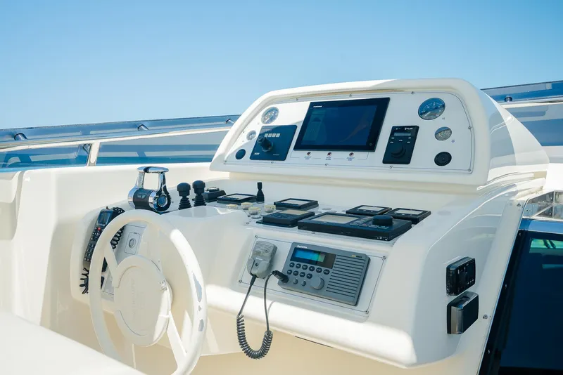 Slide: The Image of Control panel of a 2012 Custom Line 100 yacht with navigation instruments. - 38