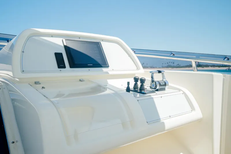 Slide: The Image of Control panel of a 2012 Custom Line 100 yacht under clear blue sky. - 39