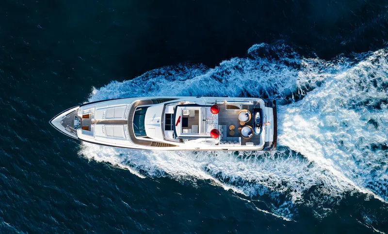 Slide: The Image of Aerial view of 2012 Custom Line 100 yacht cruising on the ocean. - 4