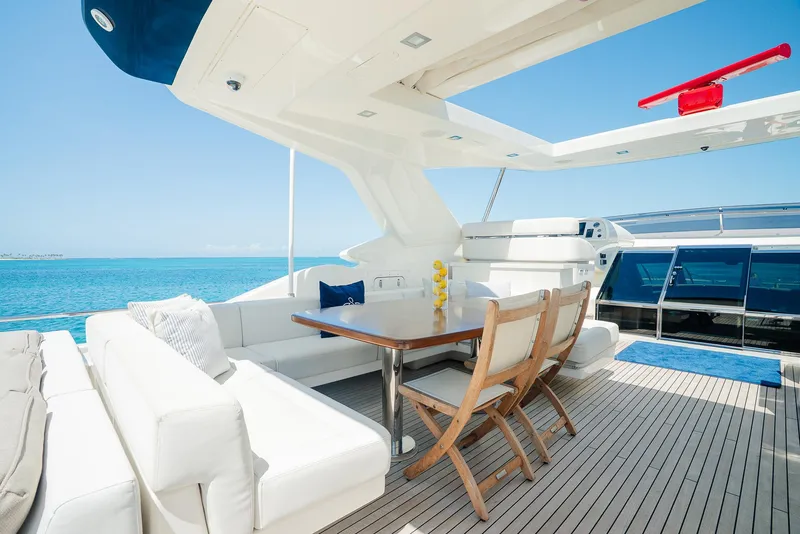 Slide: The Image of Luxurious 2012 Custom Line 100 yacht deck with elegant seating and ocean view. - 41