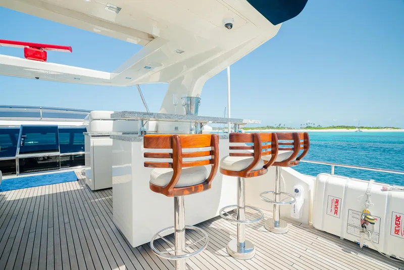 Slide: The Image of Luxury yacht deck with bar stools, ocean view, Custom Line 100, 2012 model. - 42
