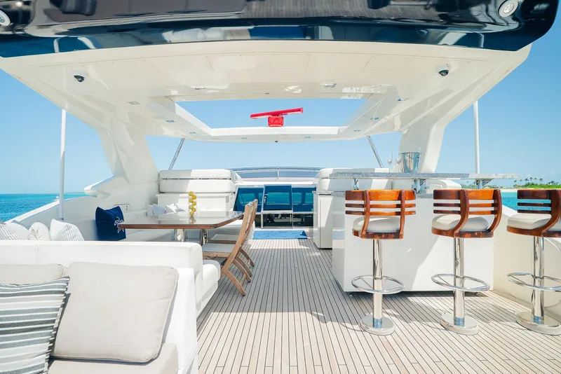 Slide: The Image of Luxurious yacht deck with seating and bar stools, Custom Line 100, 2012 model. - 43