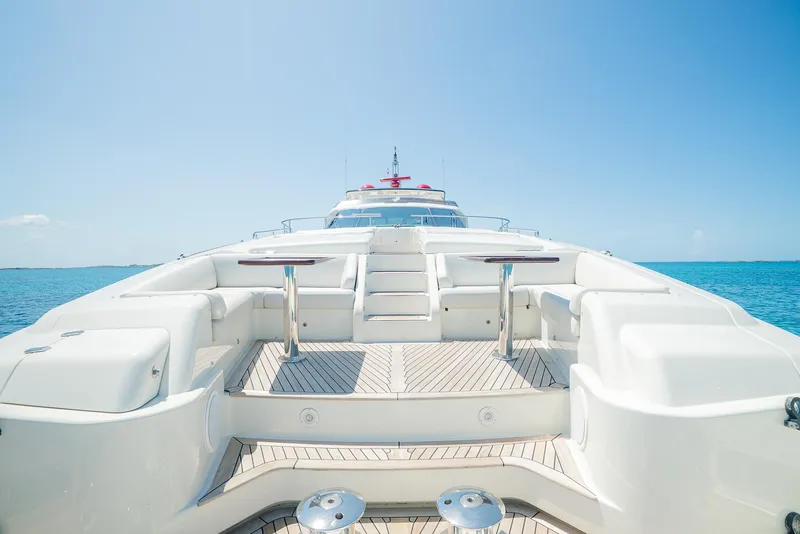 Slide: The Image of Luxurious 2012 Custom Line 100 yacht deck with ocean view under clear blue sky. - 48