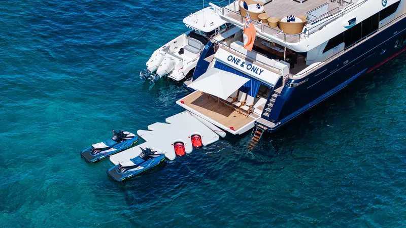 Slide: The Image of Luxury yacht "One & Only" with jet skis on turquoise water, Custom Line 100, 2012 model. - 7