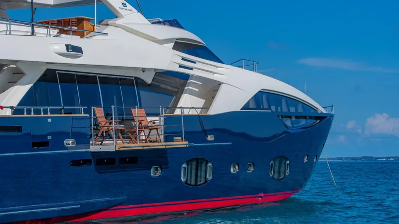 Slide: The Image of Luxurious 2012 Custom Line 100 yacht on blue ocean waters under clear skies. - 8