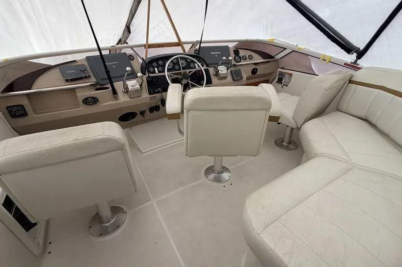 Slide: The Image of 2006 Carver 41 Cockpit Motor Yacht helm with Raymarine navigation system. - 18