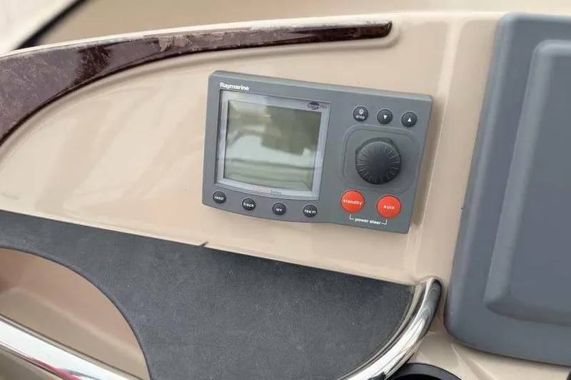 Slide: The Image of Control panel of a 2006 Carver 41 Cockpit Motor Yacht with navigation display. - 21