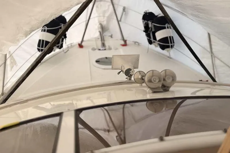 Slide: The Image of Interior of 2006 Carver 41 Cockpit Motor Yacht with cozy seating and carpeted steps. - 25