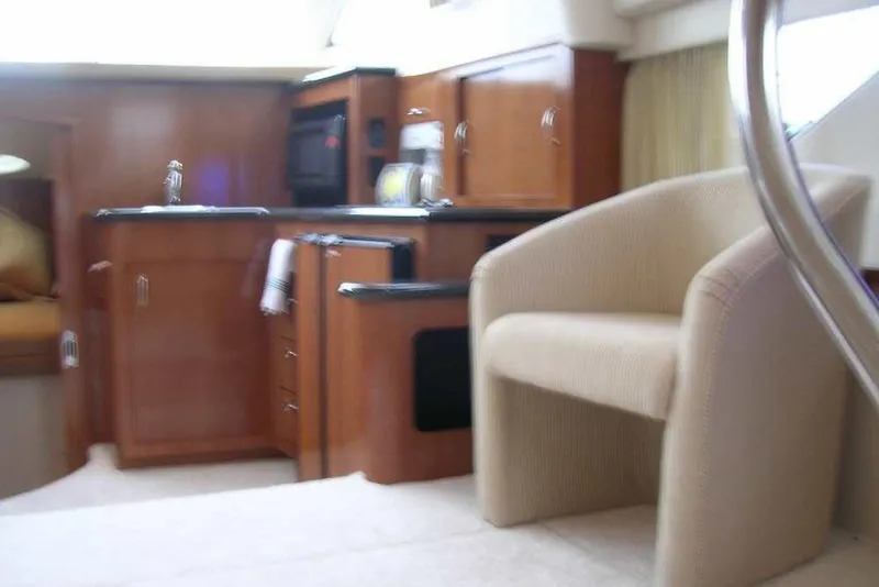 Slide: The Image of Luxurious interior of 2006 Carver 41 Cockpit Motor Yacht with beige leather seating. - 28