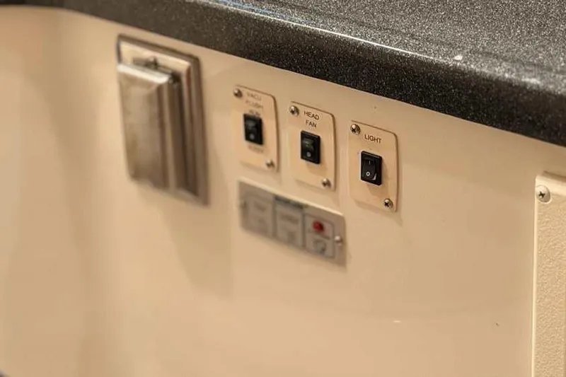 Slide: The Image of Closet interior of 2006 Carver 41 Cockpit Motor Yacht with shelves and hangers. - 34