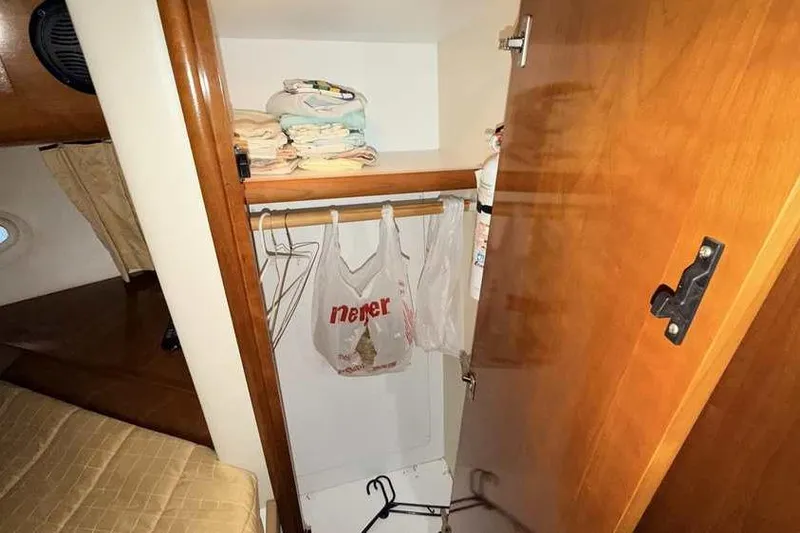 Slide: The Image of Luxurious bedroom in 2006 Carver 41 Cockpit Motor Yacht with elegant bedding. - 37