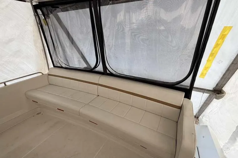 Slide: The Image of Interior view of 2006 Carver 41 Cockpit Motor Yacht, featuring seating and enclosed cockpit. - 5