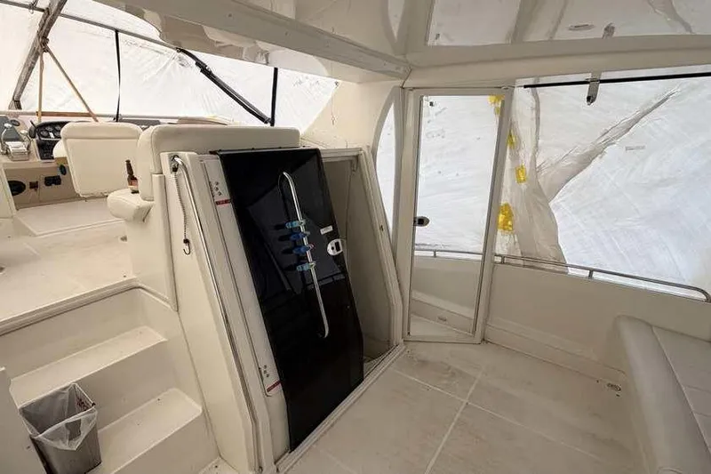Slide: The Image of Interior seating of 2006 Carver 41 Cockpit Motor Yacht with beige upholstery. - 6