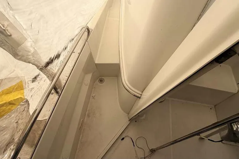 Slide: The Image of 2006 Carver 41 Cockpit Motor Yacht interior with protective covering. - 8