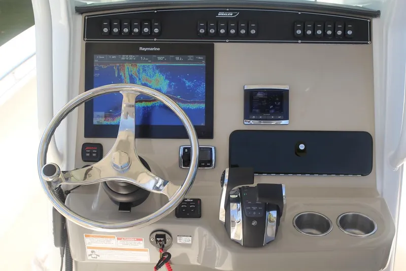 Slide: The Image of Manufacturer Provided Image: 2025 Boston Whaler 250 Outrage helm with advanced navigation system and controls. - 15