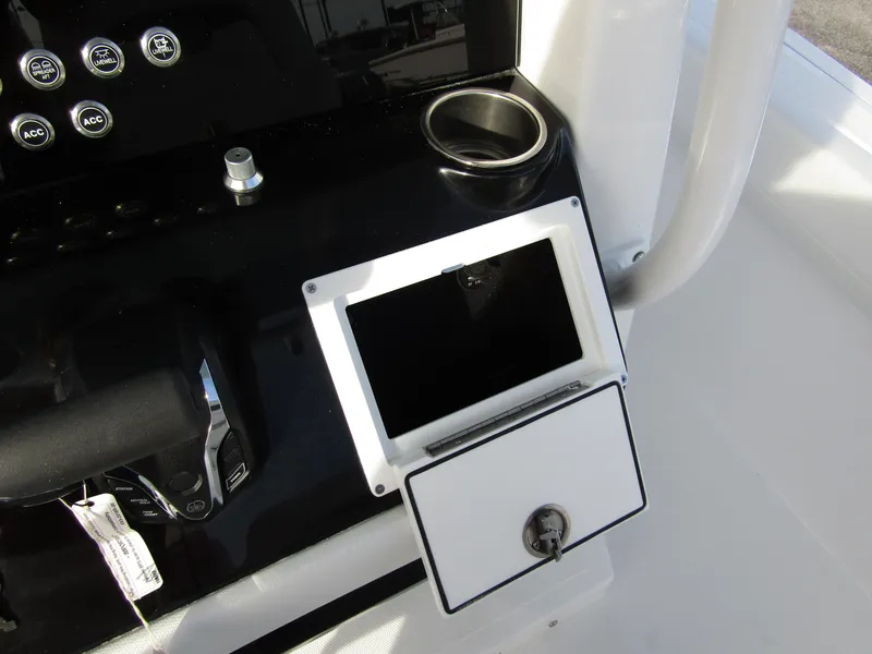 Slide: The Image of Wellcraft 243 Fisherman 2025 console with cup holder and storage compartment. - 22