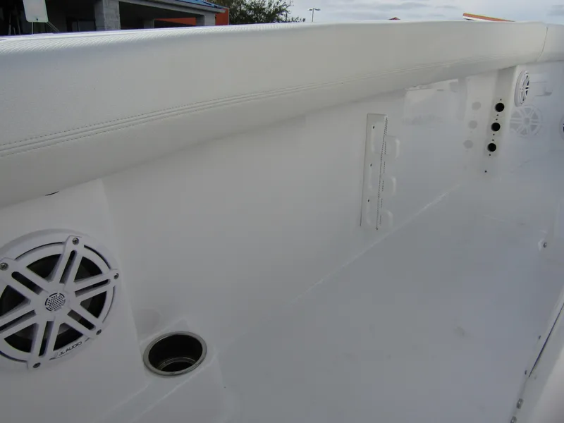 Slide: The Image of 2025 Wellcraft 243 Fisherman boat interior with speakers and cup holder. - 26