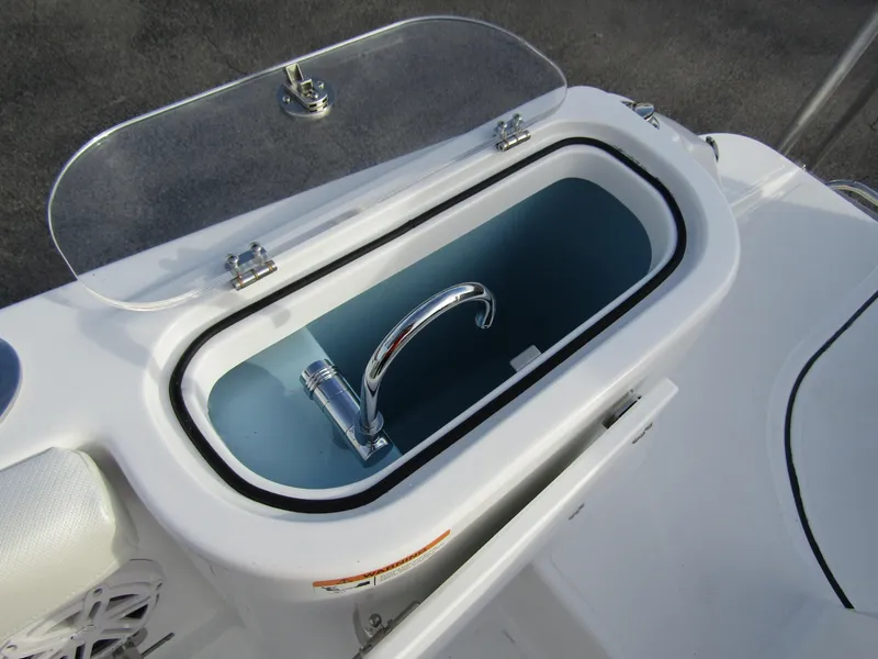 Slide: The Image of Livewell on 2025 Wellcraft 243 Fisherman boat, featuring a sleek design and functional faucet. - 30