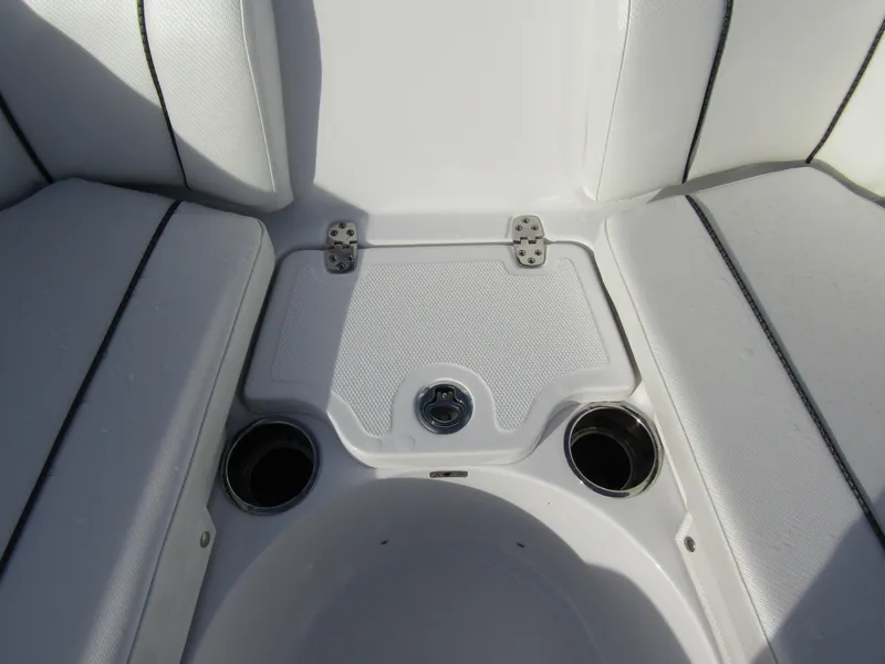 Slide: The Image of 2025 Wellcraft 243 Fisherman boat seating area with cup holders and storage. - 10