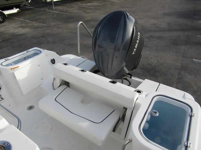 Slide: The Image of 2025 Wellcraft 243 Fisherman boat with Yamaha outboard motor, featuring spacious deck layout. - 28