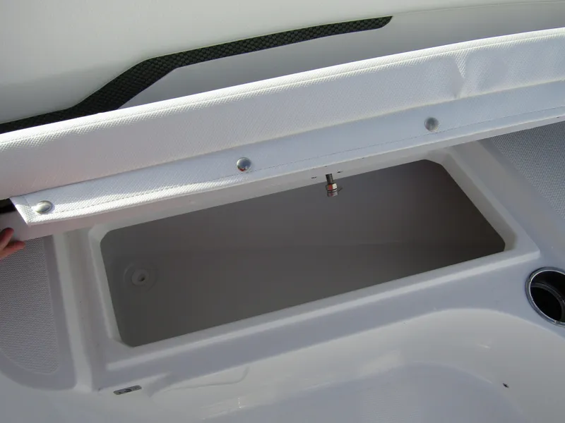 Slide: The Image of 2025 Wellcraft 243 Fisherman boat storage compartment, open lid view. - 9