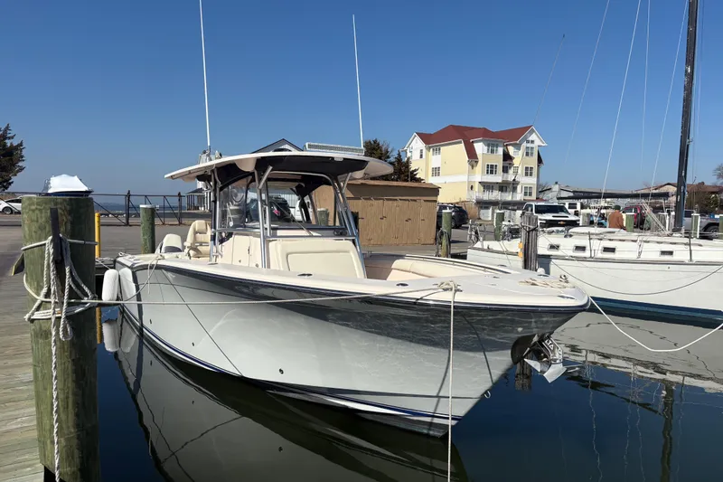 The Image of 2008 Grady-White Canyon 336 boat docked at marina, clear sky background. - 0