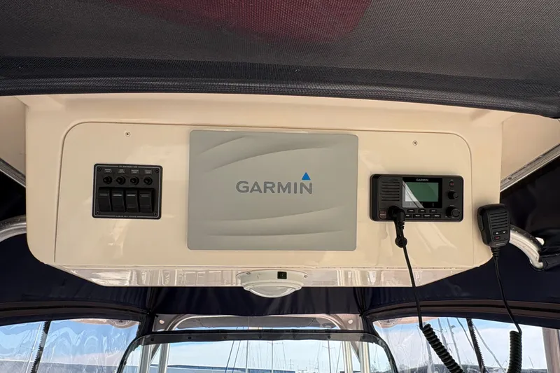 Slide: The Image of 2008 Grady-White Canyon 336 boat dashboard with Garmin navigation system. - 15