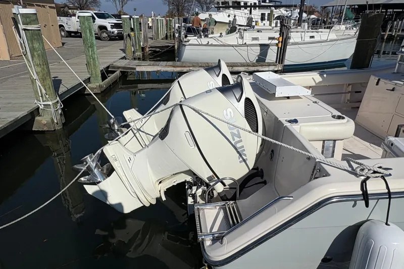 Slide: The Image of 2008 Grady-White Canyon 336 boat with Suzuki outboard engines docked at marina. - 3