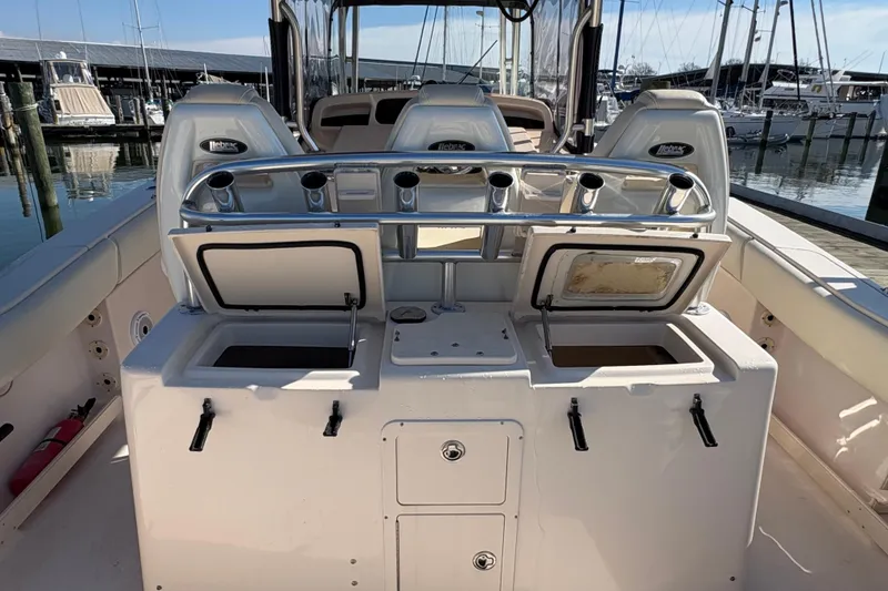 Slide: The Image of 2008 Grady-White Canyon 336 boat interior with open storage compartments at marina. - 5