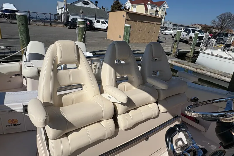 Slide: The Image of Luxury seating on a 2008 Grady-White Canyon 336 boat at a marina. - 6