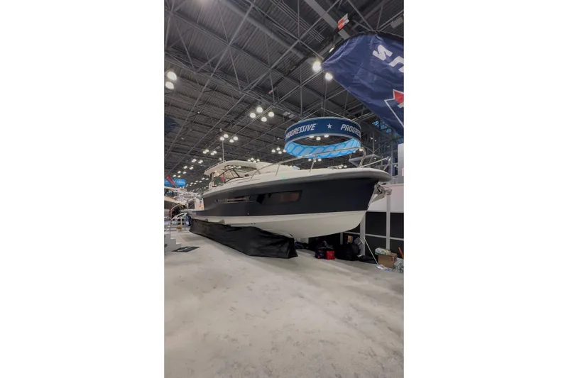 Slide: The Image of Nimbus W11 2025 displayed at a boat show. - 1