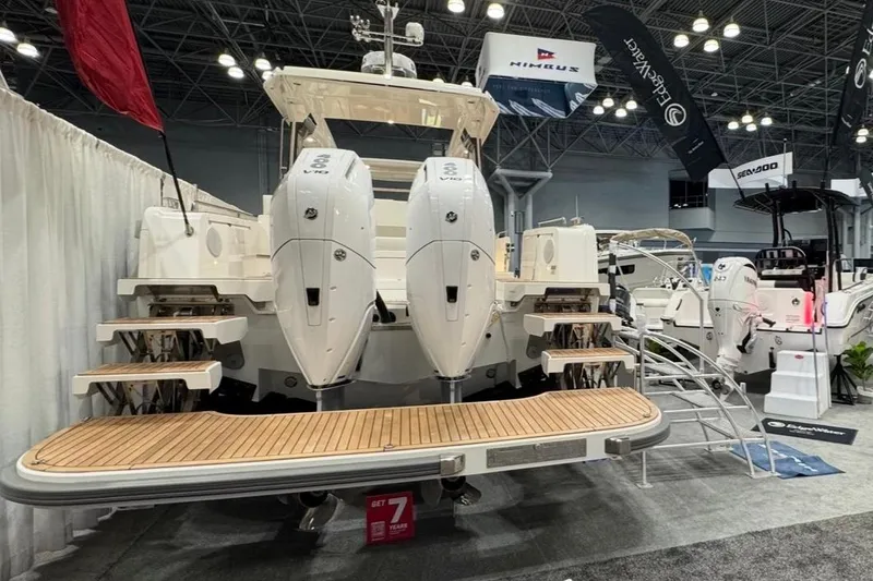 Slide: The Image of Nimbus W11 2025 boat with twin outboard engines at a trade show. - 3