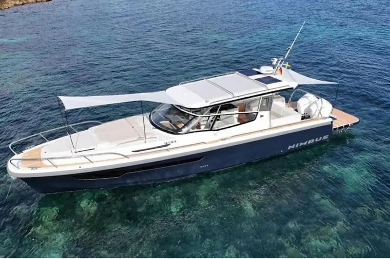 Slide: The Image of Nimbus W11 2025 boat on clear blue water, featuring sleek design and modern amenities. - 4