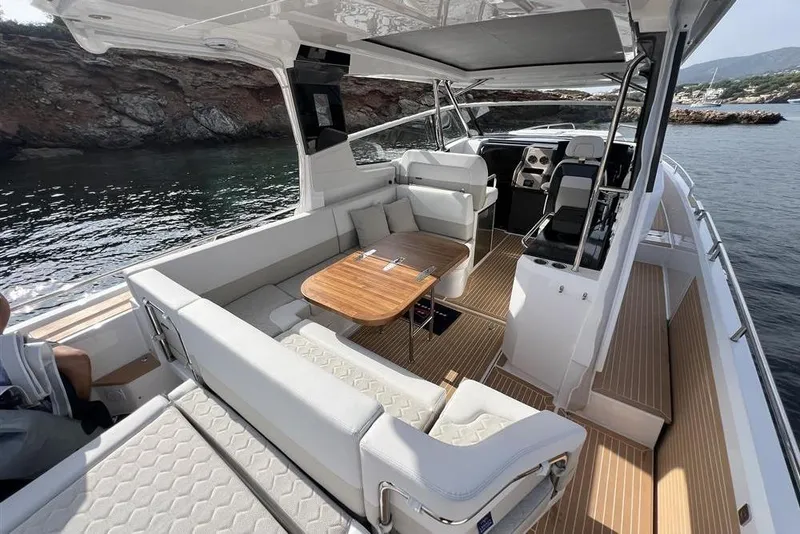 Slide: The Image of Luxury Nimbus W11 2025 yacht with twin Mercury engines on serene water. - 10