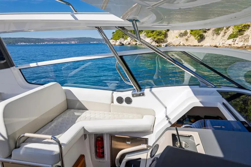 Slide: The Image of Interior of Nimbus W11 yacht, 2025 model, featuring luxurious seating area. - 18