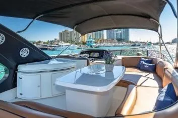 Slide: The Image of Luxurious 2007 Azimut Fly 62 yacht interior with elegant seating and waterfront view. - 4