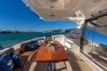 Slide: The Image of Luxurious 2007 Azimut Fly 62 yacht deck with elegant seating and ocean view. - 6