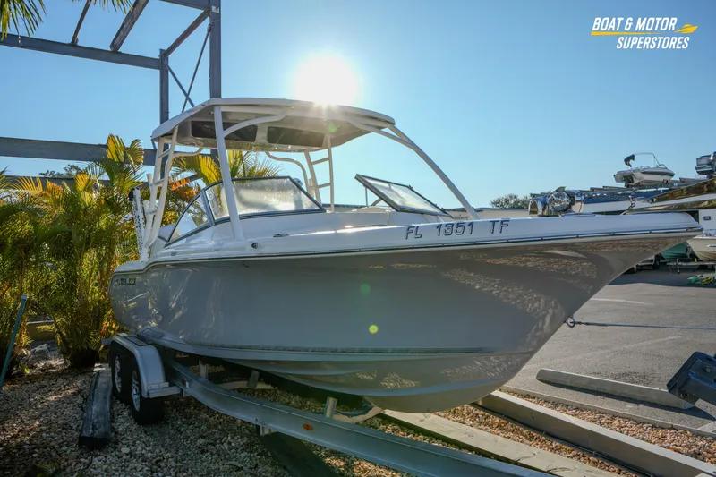 Slide: The Image of 2022 Key West 239 DFS boat on trailer, sunlit, at Boat & Motor Superstores. - 10
