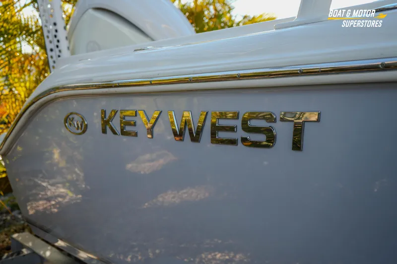 Slide: The Image of 2022 Key West 239 DFS boat side view with logo in sunlight. - 12
