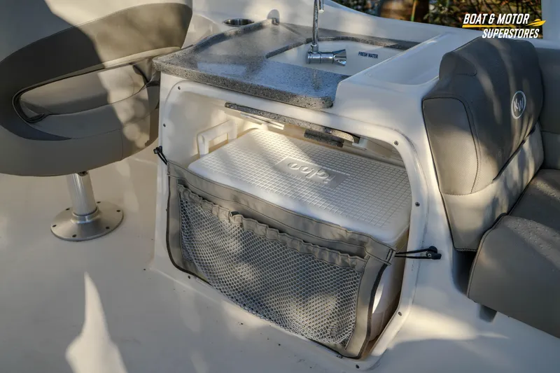 Slide: The Image of 2022 Key West 239 DFS boat interior with sink and storage area. - 23