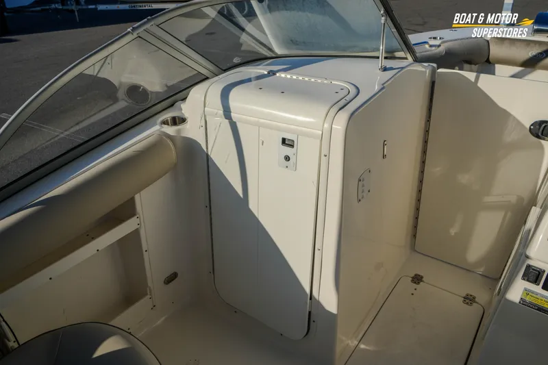 Slide: The Image of 2022 Key West 239 DFS boat interior with seating and storage compartments. - 27