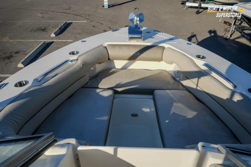 Slide: The Image of 2022 Key West 239 DFS boat interior with cushioned seating and cup holders. - 29