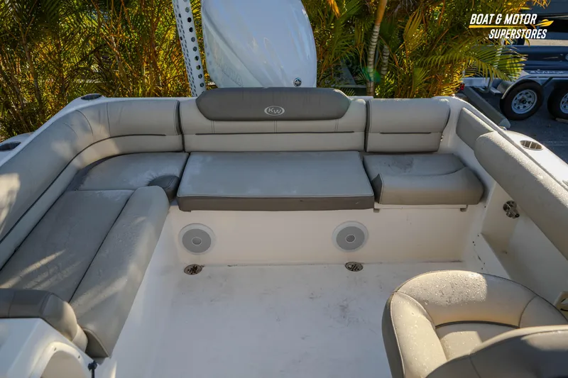 Slide: The Image of 2022 Key West 239 DFS boat interior with cushioned seating and speakers. - 40