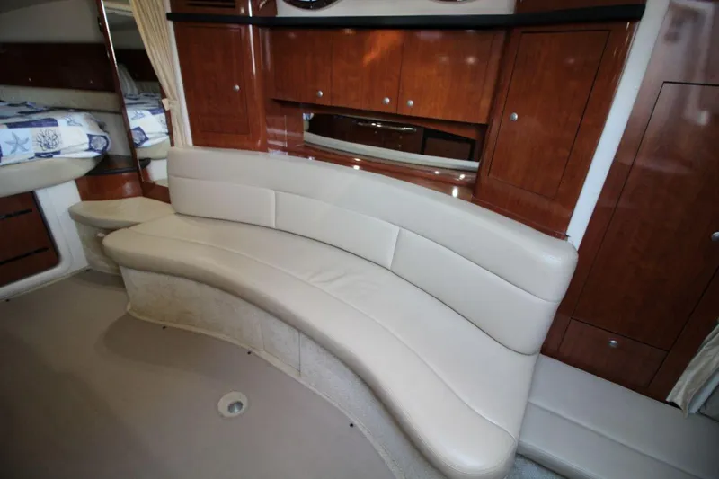 Slide: The Image of Interior view of 2006 Sea Ray 340 Sundancer boat cockpit with white seating. - 10