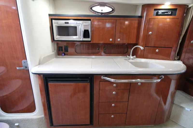 Slide: The Image of 2006 Sea Ray 340 Sundancer helm with dual seats and modern controls. - 11